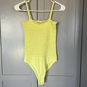 Yellow bodysuit